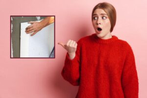 donna con espressione scioccata e operaio che installa dei pannelli isolanti dentro ad una casa